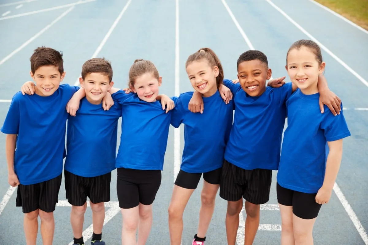 Portrait Of Children In Athletics Team On Track On Sports Day
